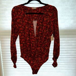 Flower-patterned, long sleeve, Free People body suit. Brand new with tags.